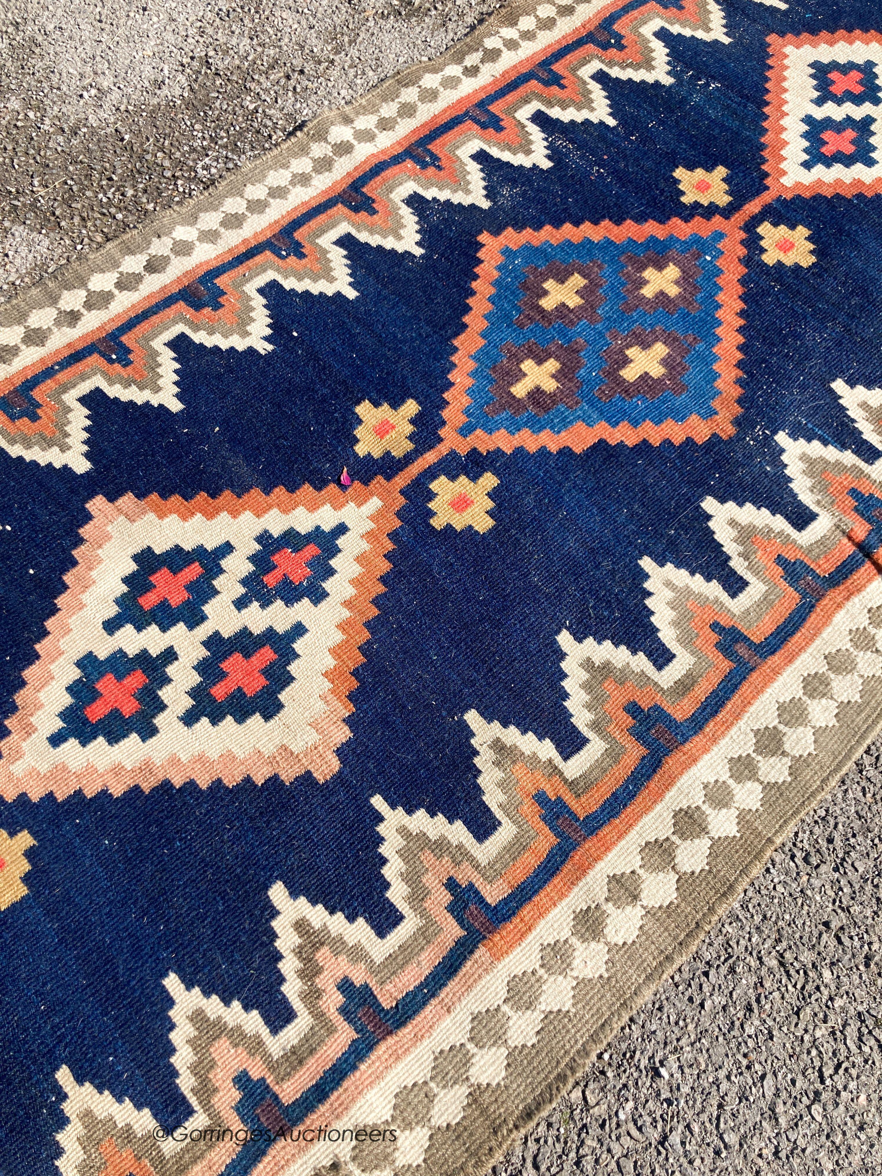 A long Eastern flatweave Kelim runner, 540 x 108cm